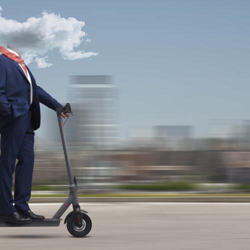 Businessman with brain fog riding an electric scooter